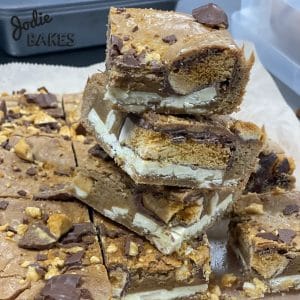 Stack of thick blondies with a biscuit layer, by Jodie Bakes, Leeds
